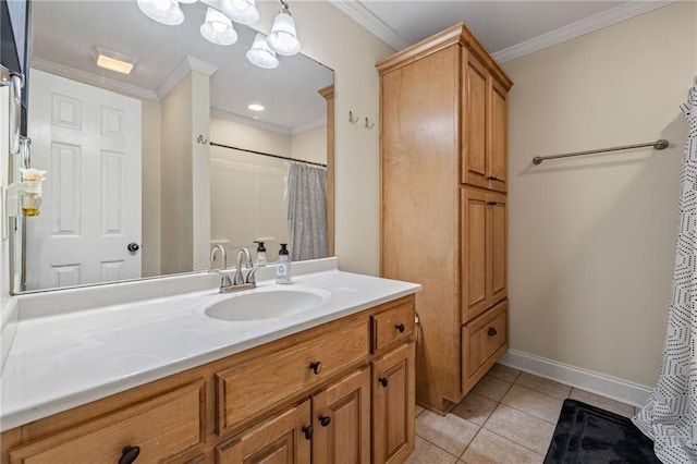 bathroom with tile patterned floors, vanity, ornamental molding, and baseboards