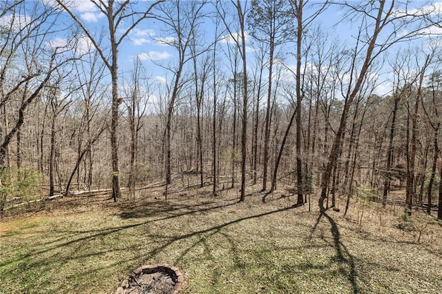 view of landscape with a forest view