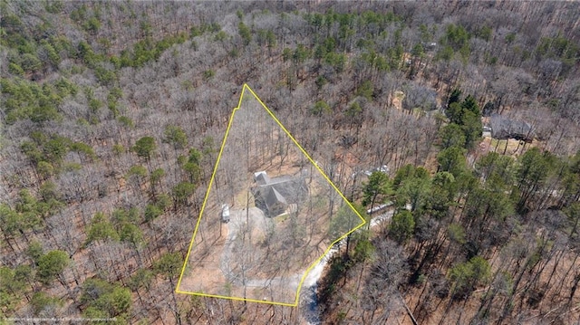 bird's eye view featuring a wooded view
