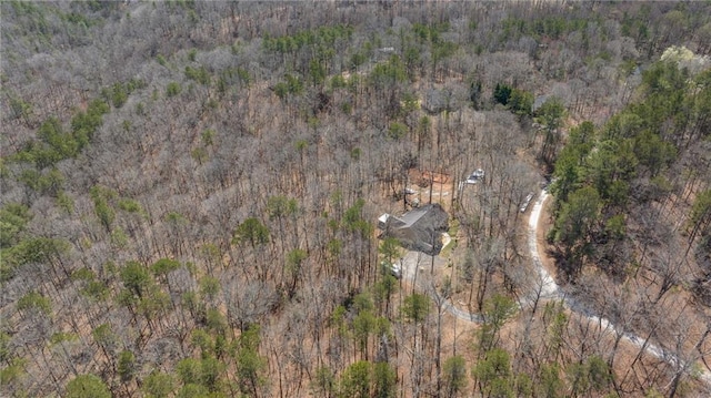 bird's eye view featuring a forest view