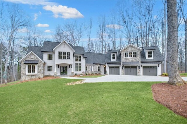 view of front of house featuring a garage and a front yard