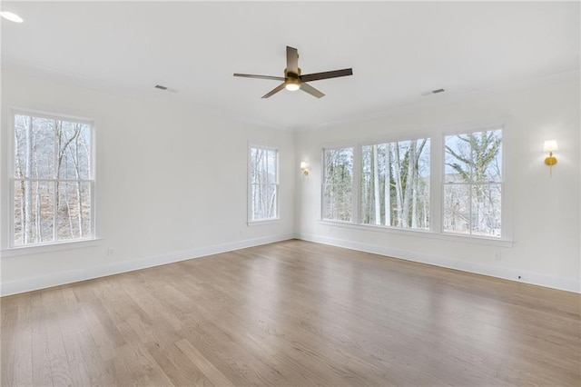 empty room with ceiling fan and light wood-type flooring