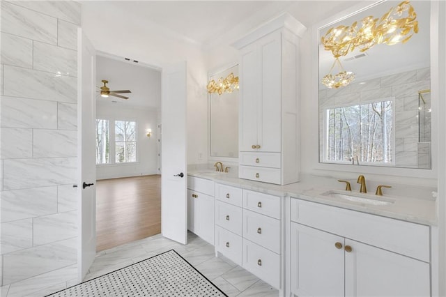 bathroom featuring ceiling fan and vanity