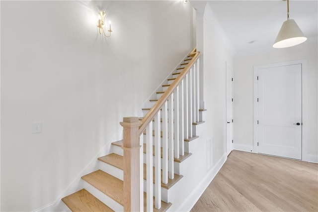 staircase featuring hardwood / wood-style floors