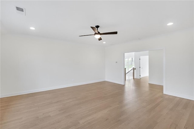 unfurnished room with ceiling fan and light hardwood / wood-style flooring