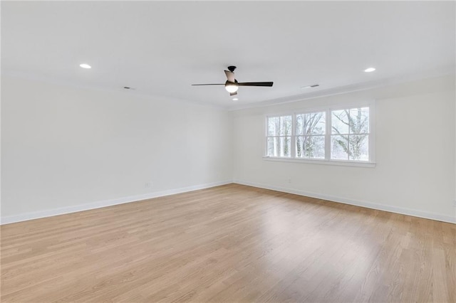 unfurnished room featuring ceiling fan and light wood-type flooring