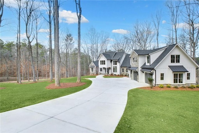 view of front of house featuring a garage and a front yard