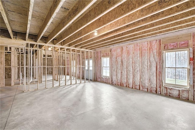 misc room with plenty of natural light and concrete floors