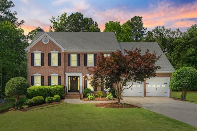 1661 Duxbury Ln NW, Kennesaw, GA 30152 - colonial house featuring driveway, brick siding, a front yard, and a chimney