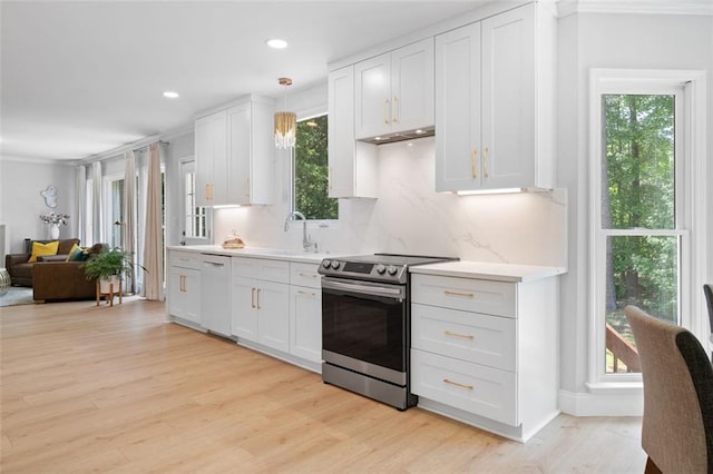 1661 Duxbury Ln NW, Kennesaw, GA 30152 - kitchen with stainless steel electric range, white dishwasher, a sink, plenty of natural light, and recessed lighting