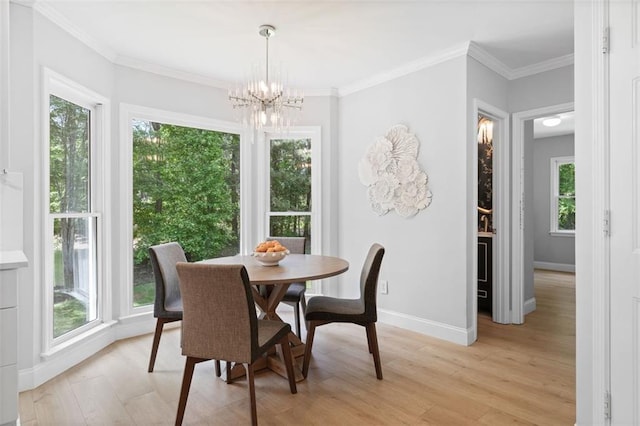 1661 Duxbury Ln NW, Kennesaw, GA 30152 - dining space with a chandelier, light wood-style flooring, baseboards, and ornamental molding