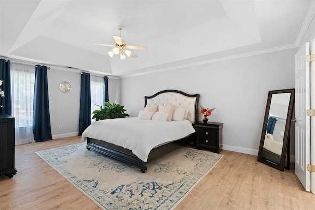1661 Duxbury Ln NW, Kennesaw, GA 30152 - bedroom with a raised ceiling, light wood-type flooring, and baseboards