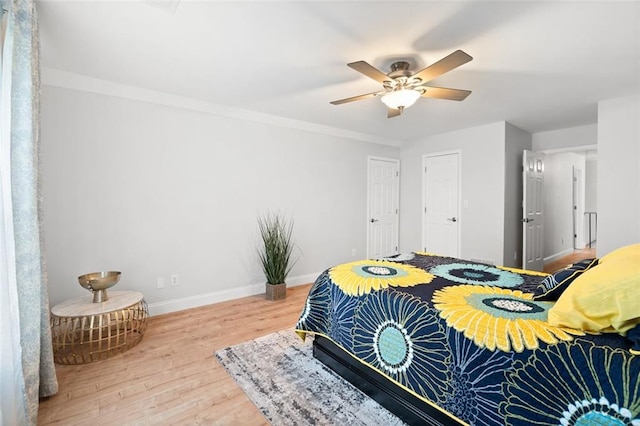 1661 Duxbury Ln NW, Kennesaw, GA 30152 - bedroom featuring wood finished floors, baseboards, and ceiling fan