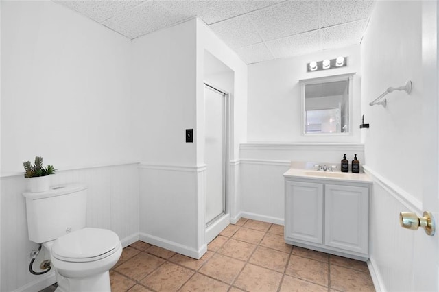 1661 Duxbury Ln NW, Kennesaw, GA 30152 - bathroom featuring a drop ceiling, wainscoting, toilet, a shower stall, and vanity