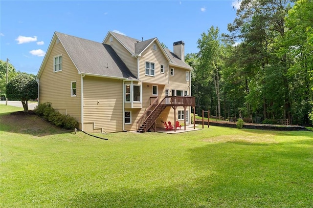 1661 Duxbury Ln NW, Kennesaw, GA 30152 - back of house with stairway, a wooden deck, a chimney, a patio, and a lawn