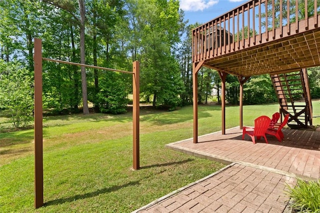 1661 Duxbury Ln NW, Kennesaw, GA 30152 - view of grassy yard with stairway, a patio area, a wooden deck, and view of scattered trees