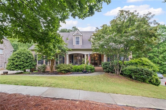 4842 Registry Dr NW, Kennesaw, GA 30152 - cape cod house featuring a front lawn and a porch