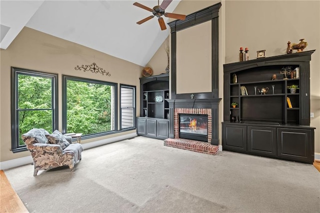 4842 Registry Dr NW, Kennesaw, GA 30152 - living room featuring a fireplace, high vaulted ceiling, ceiling fan, baseboards, and carpet flooring