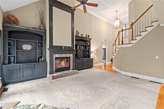 4842 Registry Dr NW, Kennesaw, GA 30152 - unfurnished living room featuring carpet, stairway, ceiling fan, a fireplace, and baseboards