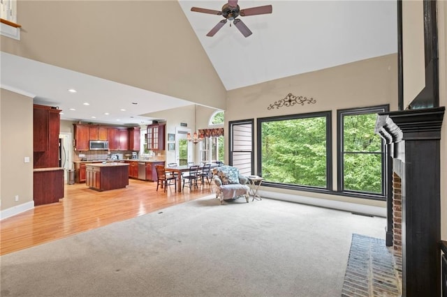 4842 Registry Dr NW, Kennesaw, GA 30152 - living room featuring light carpet, high vaulted ceiling, a ceiling fan, recessed lighting, and a brick fireplace