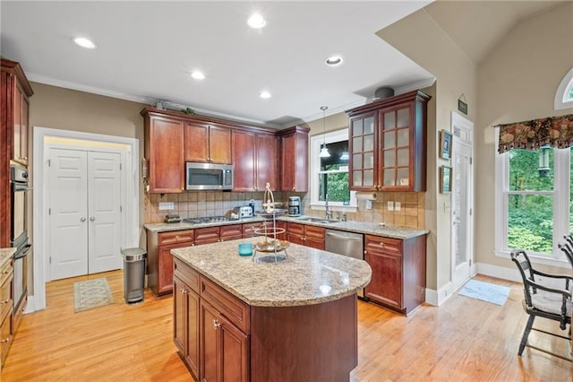 4842 Registry Dr NW, Kennesaw, GA 30152 - kitchen with appliances with stainless steel finishes, a sink, light wood finished floors, backsplash, and recessed lighting