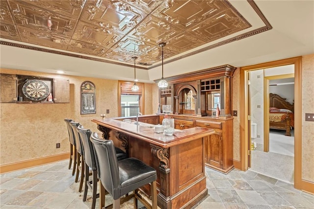4842 Registry Dr NW, Kennesaw, GA 30152 - bar featuring light stone finish flooring, decorative light fixtures, an ornate ceiling, a raised ceiling, and baseboards