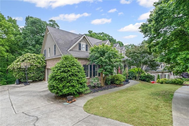 4842 Registry Dr NW, Kennesaw, GA 30152 - view of front facade featuring driveway, a garage, a front lawn, brick siding, and a shingled roof