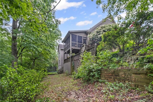 4842 Registry Dr NW, Kennesaw, GA 30152 - view of side of property with a sunroom and a trampoline