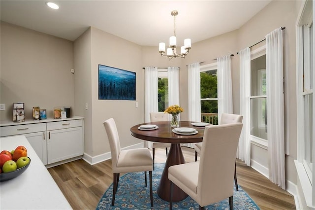 620 Reeves Hill Pt, Lawrenceville, GA 30043 - dining space with wood finished floors, a chandelier, recessed lighting, and baseboards