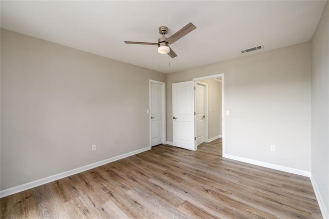620 Reeves Hill Pt, Lawrenceville, GA 30043 - unfurnished bedroom featuring baseboards, light wood-type flooring, and ceiling fan