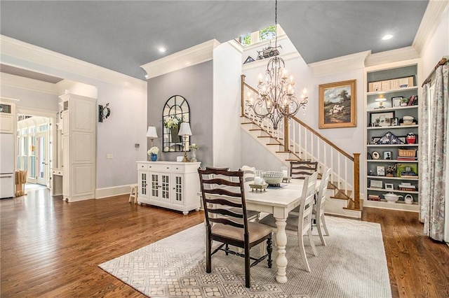 8901 Watkins Mill Rd, Winston, GA 30187 - dining space with crown molding, stairs, wood finished floors, a chandelier, and recessed lighting