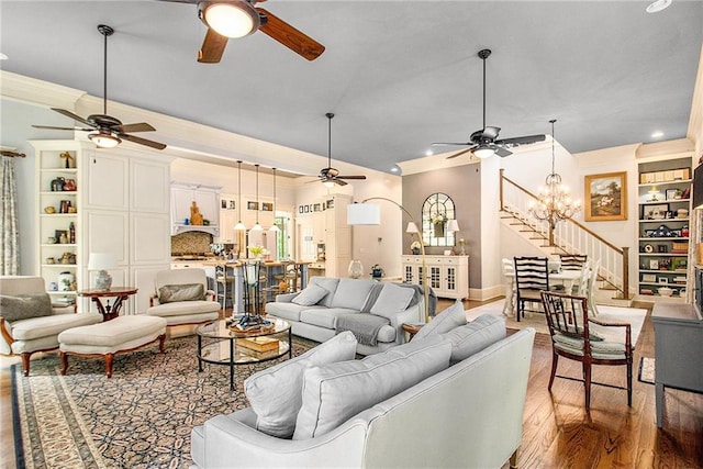 8901 Watkins Mill Rd, Winston, GA 30187 - living room featuring a ceiling fan, wood finished floors, recessed lighting, stairs, and ornamental molding