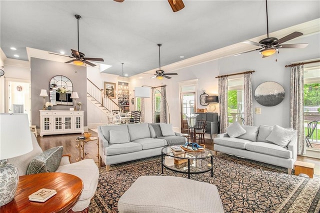 8901 Watkins Mill Rd, Winston, GA 30187 - living area featuring ceiling fan, wood finished floors, stairway, ornamental molding, and recessed lighting