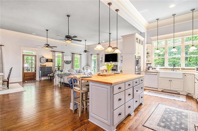 8901 Watkins Mill Rd, Winston, GA 30187 - kitchen featuring dishwasher, a sink, butcher block counters, a kitchen island, and open floor plan