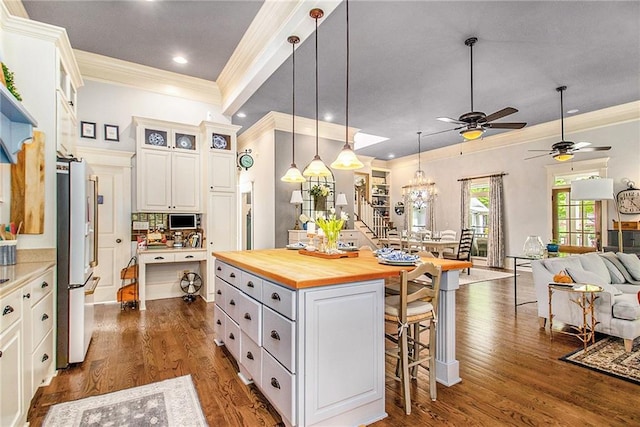 8901 Watkins Mill Rd, Winston, GA 30187 - kitchen with wood counters, crown molding, a kitchen breakfast bar, open floor plan, and high end fridge