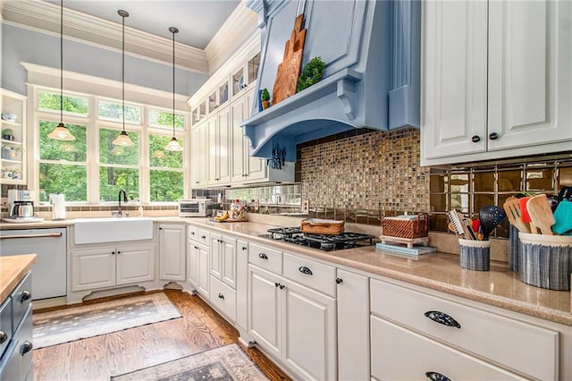 8901 Watkins Mill Rd, Winston, GA 30187 - kitchen featuring dishwasher, a sink, black gas stovetop, plenty of natural light, and ornamental molding