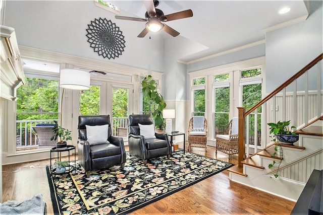 8901 Watkins Mill Rd, Winston, GA 30187 - sitting room featuring stairs, wood finished floors, ceiling fan, ornamental molding, and french doors