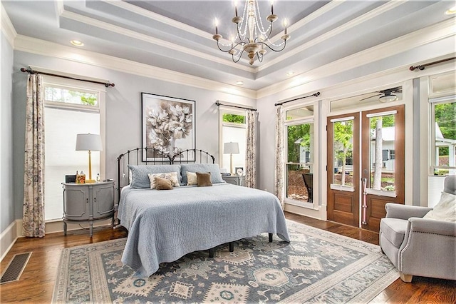 8901 Watkins Mill Rd, Winston, GA 30187 - bedroom with a chandelier, a tray ceiling, ornamental molding, wood finished floors, and access to outside