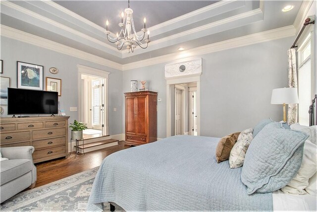 8901 Watkins Mill Rd, Winston, GA 30187 - bedroom featuring a chandelier, wood finished floors, ornamental molding, a raised ceiling, and recessed lighting