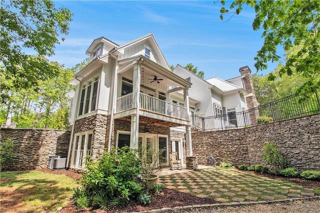 8901 Watkins Mill Rd, Winston, GA 30187 - back of property with french doors, ceiling fan, stone siding, a balcony, and board and batten siding