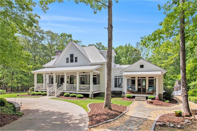 8901 Watkins Mill Rd, Winston, GA 30187 - view of front of home featuring a porch, a chimney, and metal roof