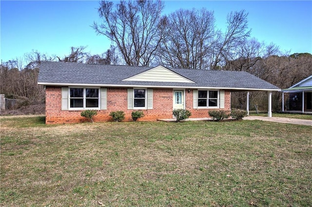 single story home with a front lawn and a carport