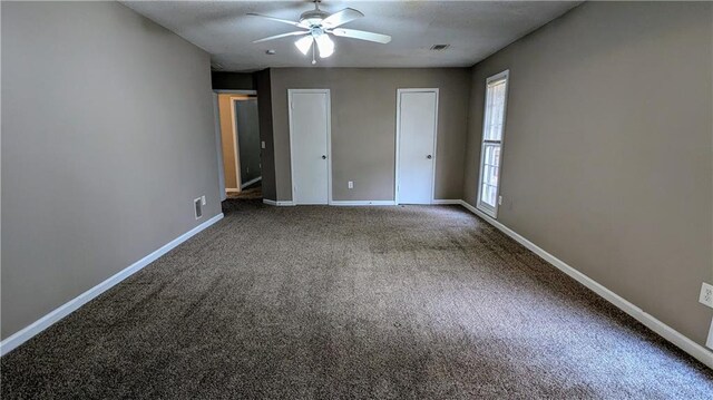 unfurnished bedroom with ceiling fan and carpet