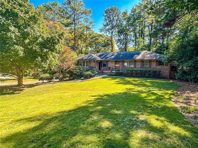 ranch-style home with a front yard