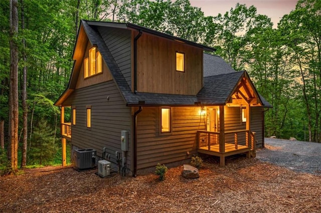 74 Cohutta Overlook Way, Blue Ridge, GA 30513 - view of side of home featuring a shingled roof, central AC, and view of scattered trees