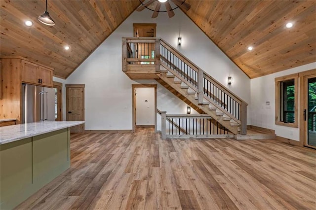 74 Cohutta Overlook Way, Blue Ridge, GA 30513 - unfurnished living room with wooden ceiling, high vaulted ceiling, light wood finished floors, baseboards, and ceiling fan