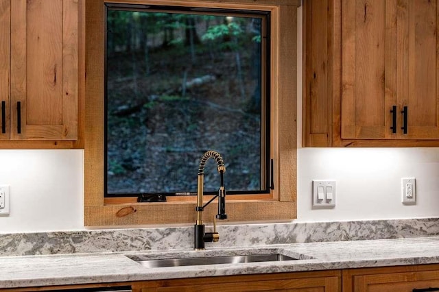 74 Cohutta Overlook Way, Blue Ridge, GA 30513 - kitchen with a sink, brown cabinets, and light stone countertops