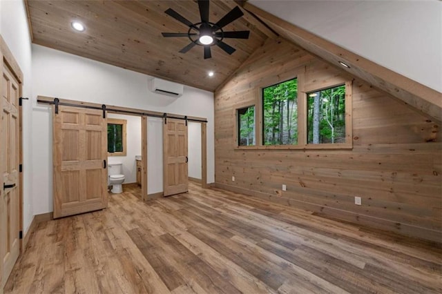 74 Cohutta Overlook Way, Blue Ridge, GA 30513 - unfurnished bedroom featuring a barn door, an AC wall unit, recessed lighting, light wood finished floors, and wood ceiling
