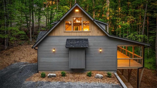 74 Cohutta Overlook Way, Blue Ridge, GA 30513 - view of front facade with a view of trees and a shingled roof