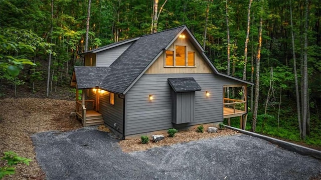 74 Cohutta Overlook Way, Blue Ridge, GA 30513 - chalet / cabin featuring a shingled roof, a forest view, and covered porch